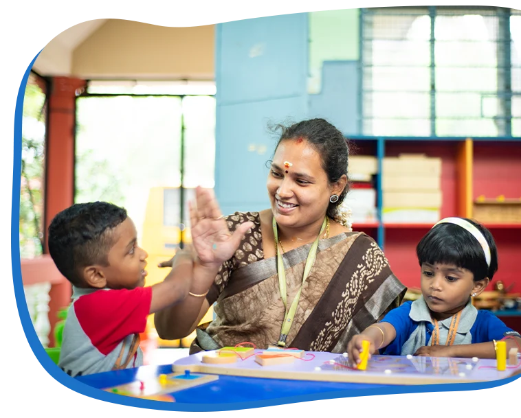Teacher guiding child with Montessori materials Madurai